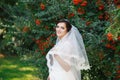 Beautiful brunette bride with bouquet outdoor. Happy bride outdo Royalty Free Stock Photo