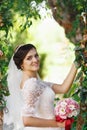 Beautiful brunette bride with bouquet outdoor. Happy bride outdo Royalty Free Stock Photo