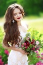 Beautiful brunette bride outdoor portrait. Woman with wedding bo Royalty Free Stock Photo