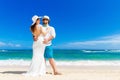 Beautiful brunette bride in white wedding dress and straw hat an Royalty Free Stock Photo