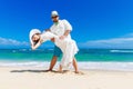 Beautiful brunette bride in white wedding dress and straw hat an Royalty Free Stock Photo