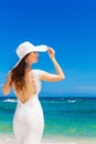 Beautiful brunette bride in white wedding dress and straw hat ha Royalty Free Stock Photo