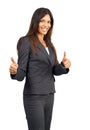 Beautiful brunette businesswoman giving thumbs up