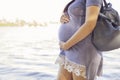 Beautiful brunette caucasian pregnant woman on summer walk outdo Royalty Free Stock Photo