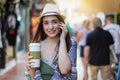 Beautiful, brunette, city girl talking to a mobile phone in the street Royalty Free Stock Photo