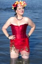 Beautiful woman in a red corset and floral chaplet