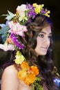 Beautiful brunette with a floral chaplet on a head