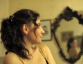 Beautiful brunette in front of mirror Royalty Free Stock Photo