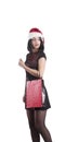Beautiful brunette girl attractive in santa braces hat shopping bag Royalty Free Stock Photo