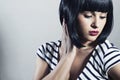 Beautiful Brunette Girl in Dress. Black Hair. bob Haircut. Red Lips. Beauty Woman with Fringe Royalty Free Stock Photo