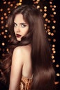 Beautiful Brunette girl with long shiny wavy hair. Elegant lady Royalty Free Stock Photo