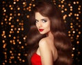 Beautiful Brunette girl with long shiny wavy hair. Elegant lady Royalty Free Stock Photo