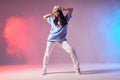 Pretty street hancer dancer in cap Royalty Free Stock Photo