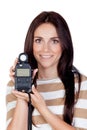Beautiful brunette girl with a photometer Royalty Free Stock Photo