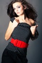 Beautiful brunette girl posing on dark background Royalty Free Stock Photo