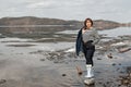 Beautiful brunette girl on the river bank Royalty Free Stock Photo