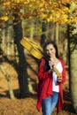 Beautiful brunette guitar player girl in the forest Royalty Free Stock Photo