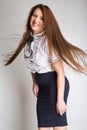 Beautiful brunette hair motion freeze isolated over white. Studio shot, vertical image Royalty Free Stock Photo