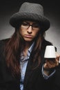 Beautiful brunette with hat and glasses posing in studio in various positions and industry-specific representations photo stock.