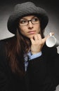 Beautiful brunette with hat and glasses posing in studio in various positions and industry-specific representations photo stock.