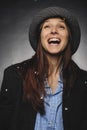 Beautiful brunette with hat and glasses posing in studio in various positions and industry-specific representations photo stock.