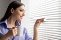 Beautiful brunette holding cup of coffee. Royalty Free Stock Photo