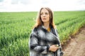 Beautiful brunette lady in wheat field at sunset. Happy beautiful woman in meadow. Royalty Free Stock Photo