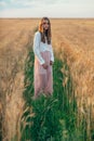 Beautiful brunette lady in wheat field at sunset Royalty Free Stock Photo