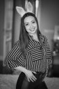 Beautiful brunette girl smiling and flirting, black and white frame. Royalty Free Stock Photo