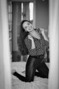 Beautiful Brunette Girl In Seductive And Flirting Pose, A Black And White Frame