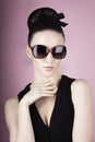 Beautiful brunette model in stylish black sunglasses Royalty Free Stock Photo