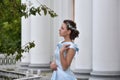 Beautiful brunette in pale blue evening dress Royalty Free Stock Photo