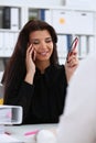 Beautiful brunette smiling businesswoman talk cellphone Royalty Free Stock Photo