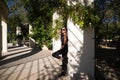 beautiful, brunette Spanish woman with black sunglasses. The woman is in the park lying on a park hill. The woman is smiling Royalty Free Stock Photo