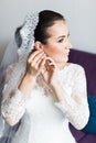 Beautiful brunette stylish bride getting ready in the morning Royalty Free Stock Photo