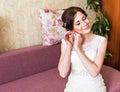 Beautiful brunette stylish bride getting ready in the morning Royalty Free Stock Photo