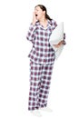 Beautiful brunette wants to sleep, yawns, dressed in pajamas Royalty Free Stock Photo