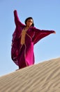 Beautiful brunette woman in arabic desert Royalty Free Stock Photo