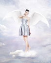 Beautiful brunette woman as angel in heaven Royalty Free Stock Photo