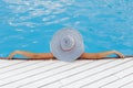 Beautiful brunette woman on the beach alone relaxing in a hat. Summer. Outdoors. Copy space. Concept Royalty Free Stock Photo