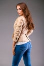 Beautiful brunette woman in a beige jacket Royalty Free Stock Photo