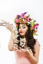 Beautiful brunette woman with a bunch of spring flowers, makeup Royalty Free Stock Photo