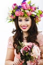 Beautiful brunette woman with a bunch of spring flowers, makeup Royalty Free Stock Photo