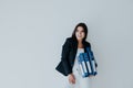 Beautiful brunette woman in business clothes with folders for papers in the office Royalty Free Stock Photo