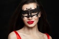 Beautiful brunette woman in carnival mask. Fashion model Royalty Free Stock Photo