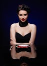 Beautiful brunette woman with chilli pepper Royalty Free Stock Photo