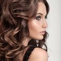 Beautiful Brunette Woman. Curly Long Hair. Royalty Free Stock Photo