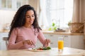 Beautiful Brunette Woman Eating Tasty Breakfast Or Lunch In Kitchen At Home Royalty Free Stock Photo