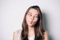 Beautiful brunette woman, making crazy funny grimace. Royalty Free Stock Photo