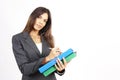 Beautiful brunette woman holding a clipboard Royalty Free Stock Photo